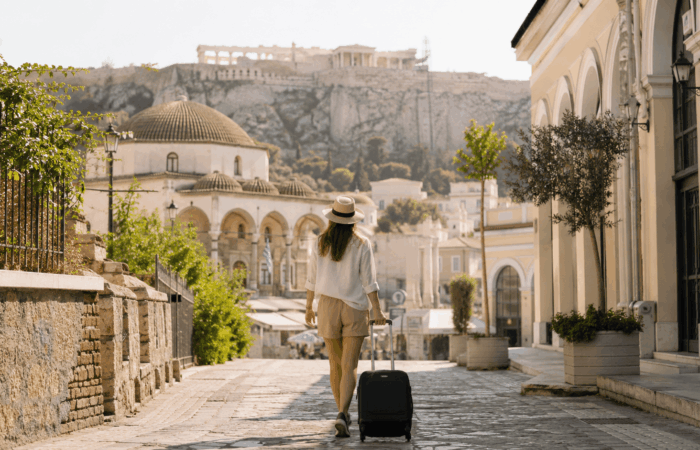 Traveler using luggage storage in Athens before hotel check-in
